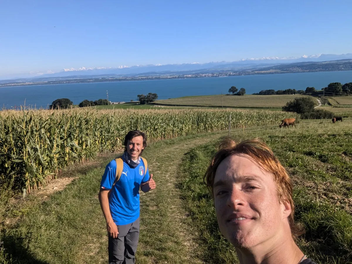 Artem and me in front of a huge see on a hike in some fields.